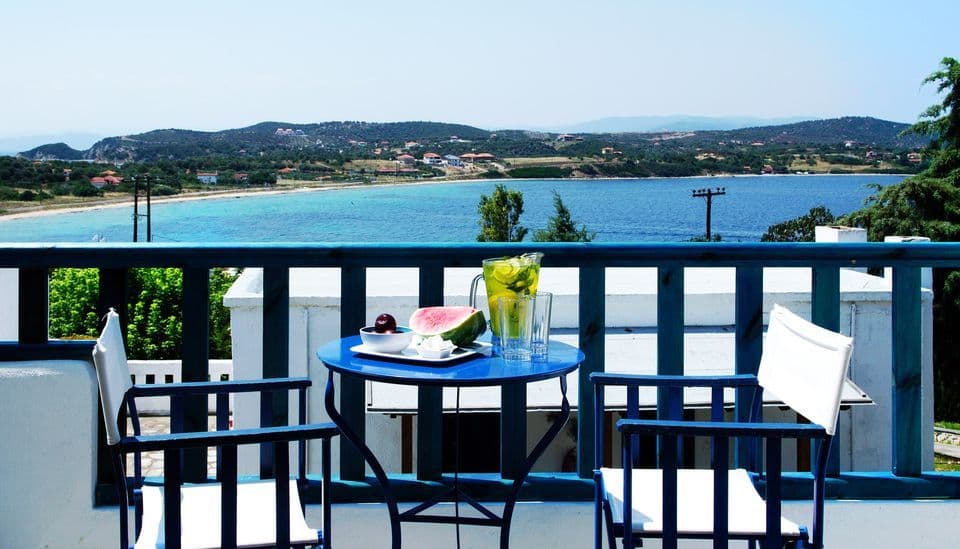 Enjoy a magnificent view over Porto Agio Beach from your own private balcony.