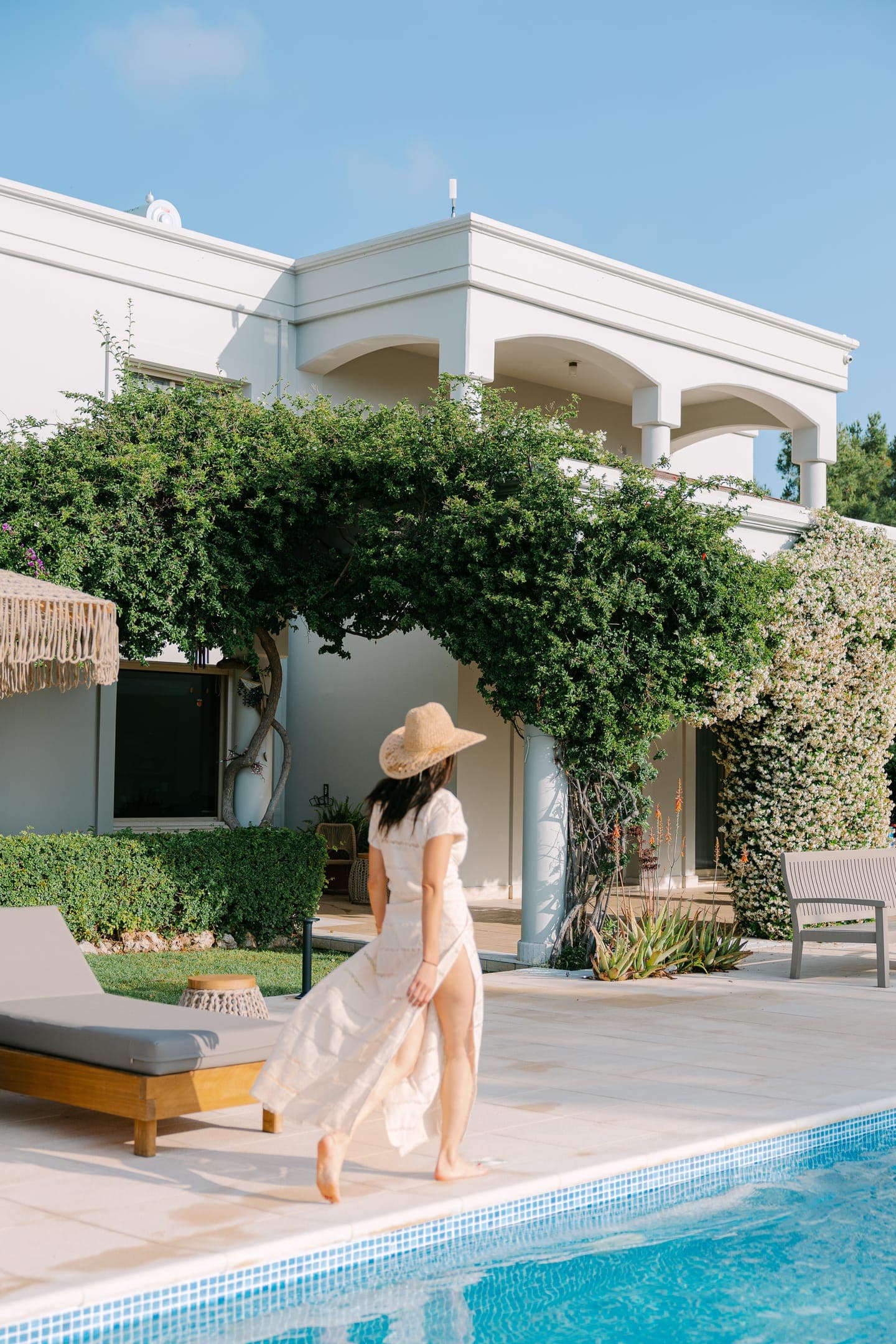 Elegant entrance surrounded by lush Mediterranean gardens
