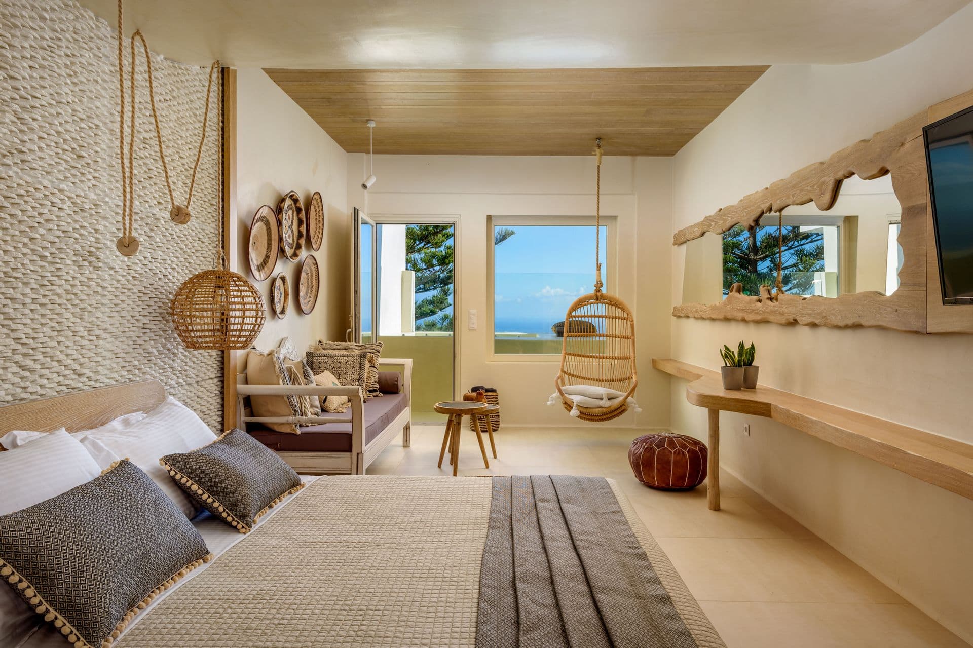 Spacious open plan bedroom with king size bed and sofa bed
