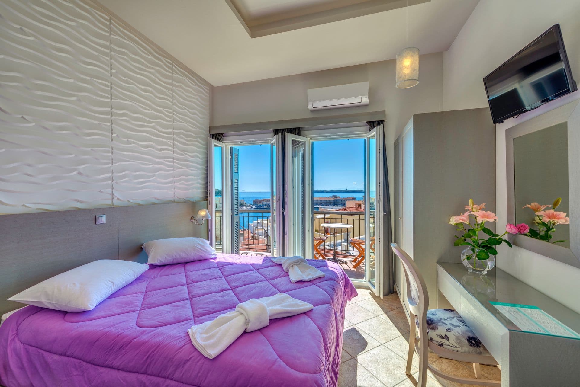 Suite with two rooms,romantic sunny view from one of the rooms.
The suite offers two rooms and accommodates  up to four persons on double  and two single beds.Every room has its furnished balcony,sea view.
