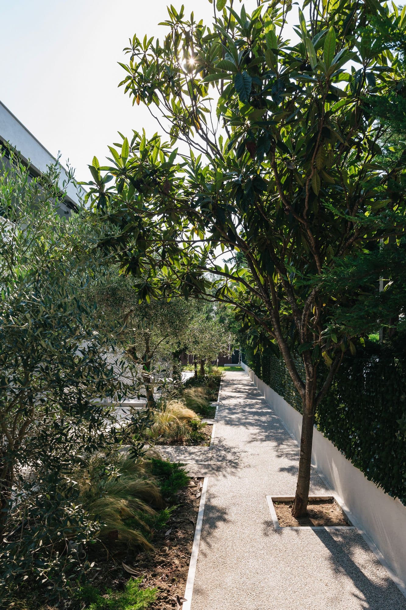 An outdoor corridor leads to the Deluxe Two-Bedroom entrances. Each apartment has its own entrance.