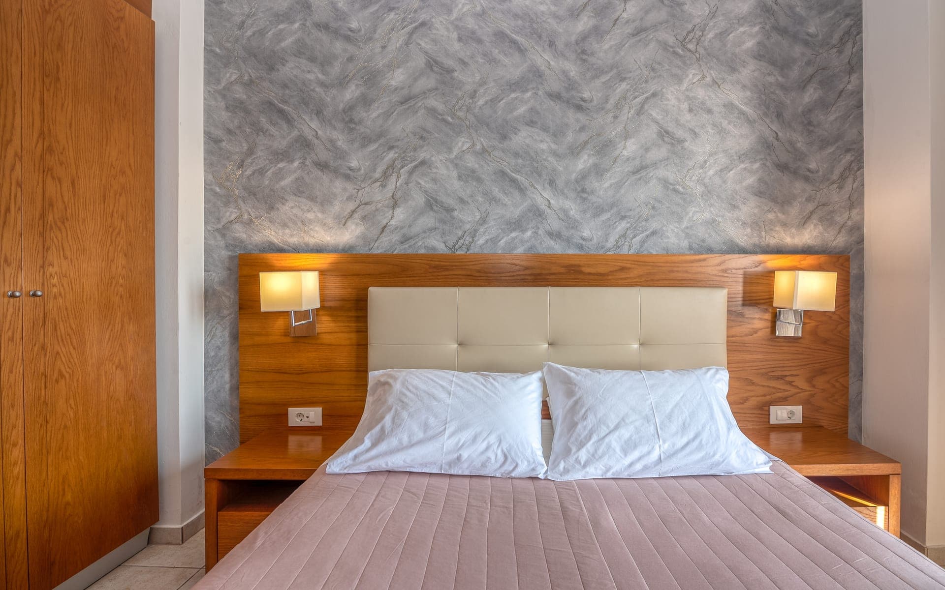 The first bedroom has one double bed.