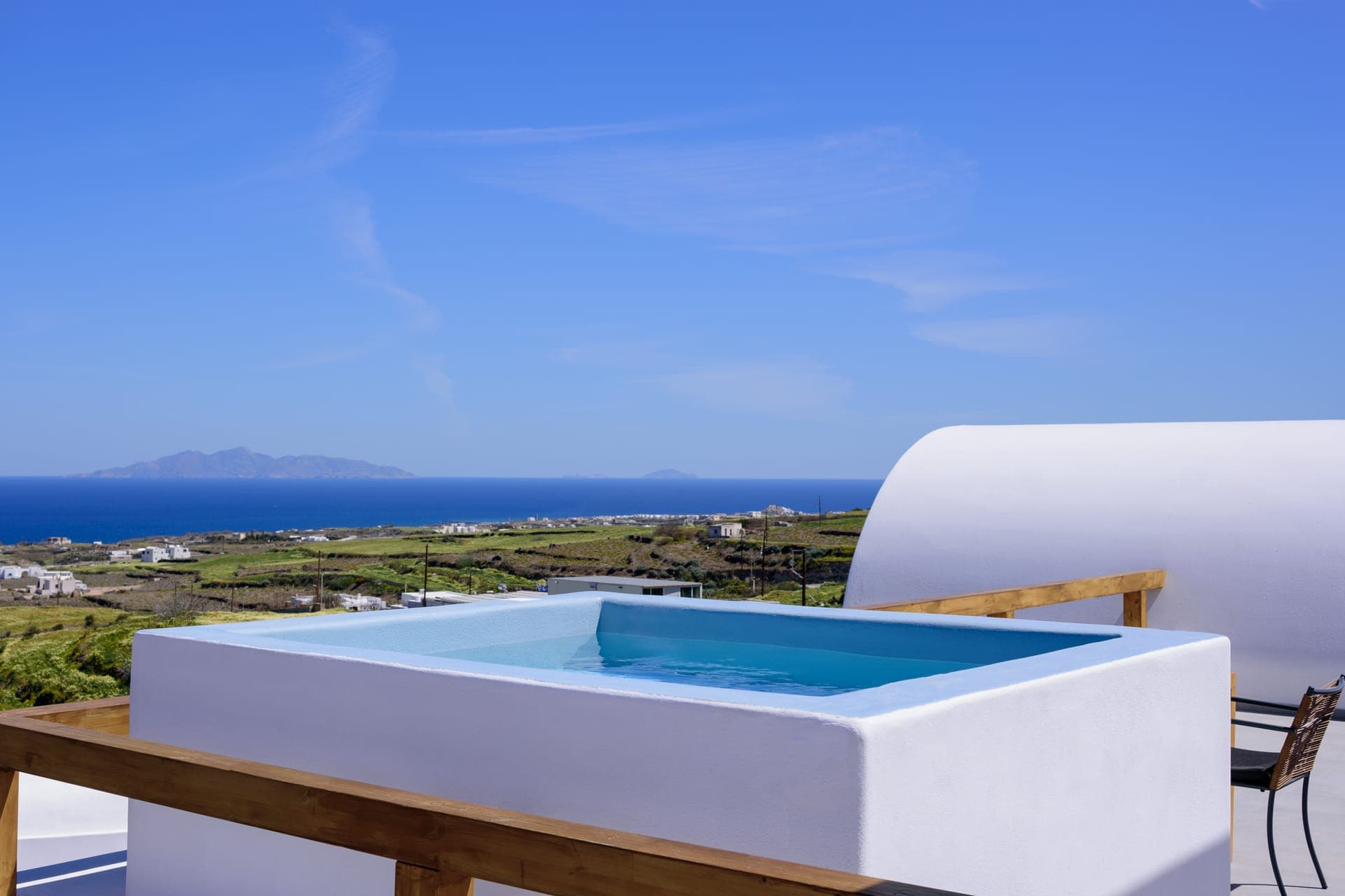 Outdoor veranda with heated jacuzzi and spellbinding view of the Aegean Sea