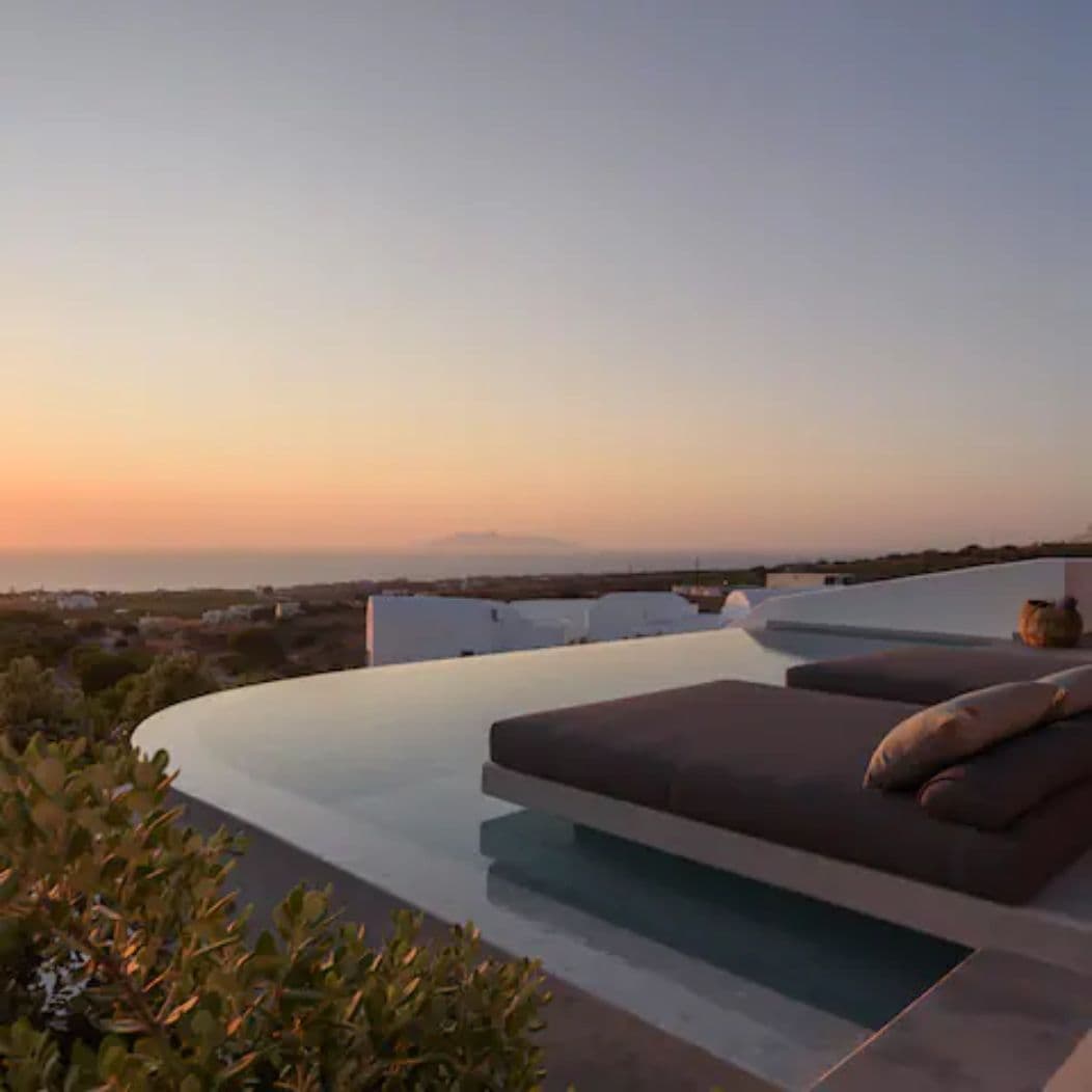 Private swimming pool with sunloungers and spellbinding view of the Aegean Sea