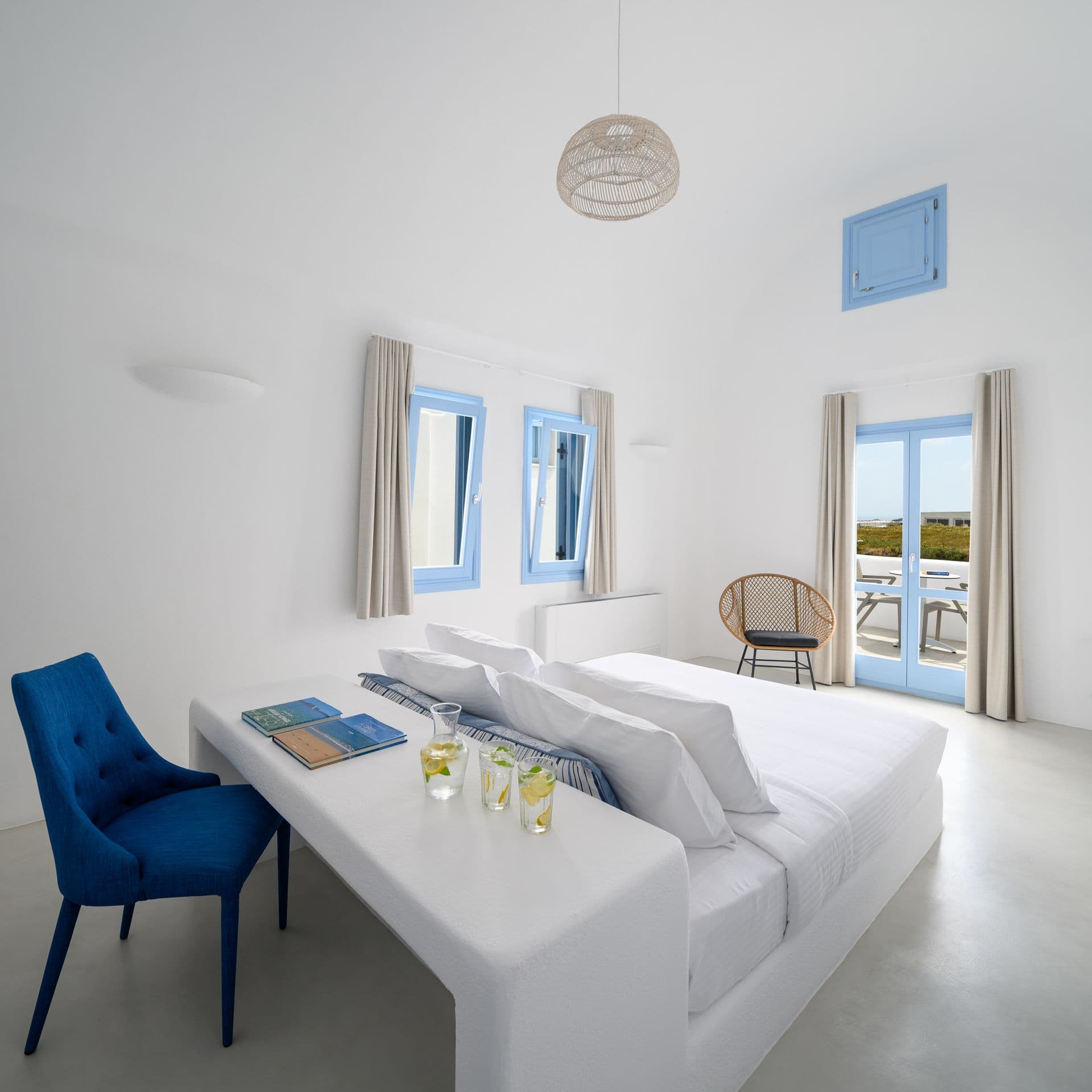 Spacious bedroom with king size bed and private balcony with sea view
