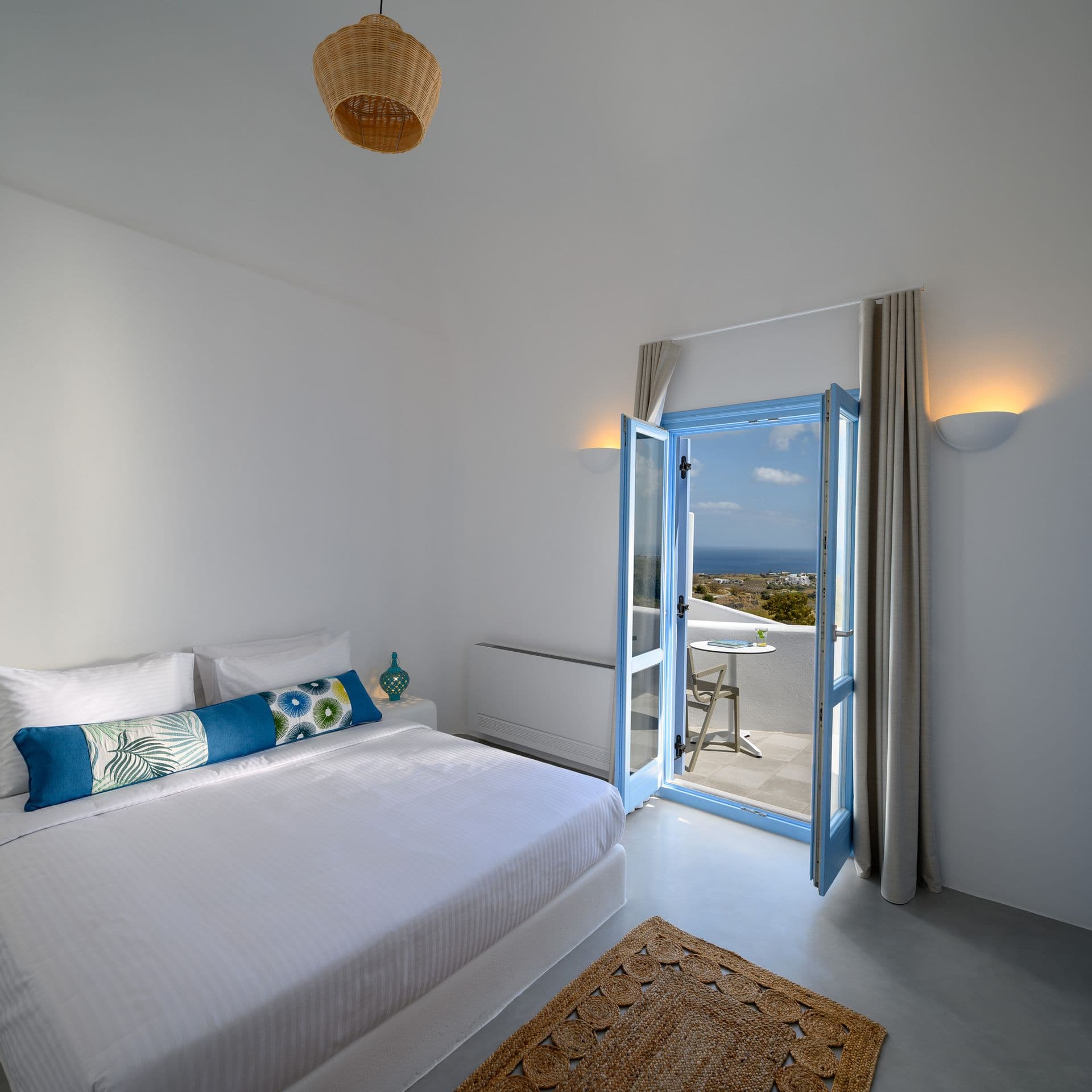 Spacious bedroom with king size bed and private balcony with sea view