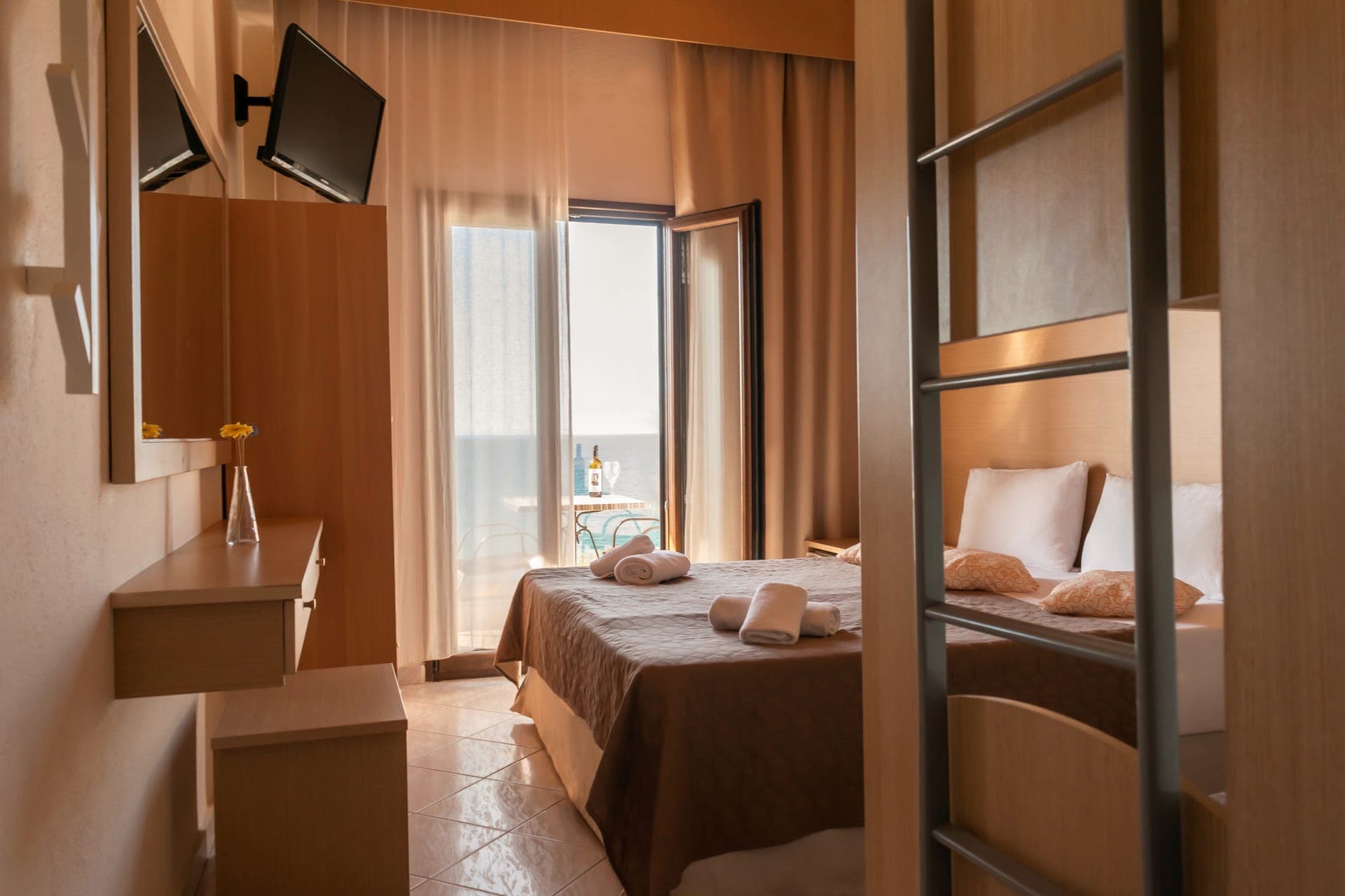 fouredded room , with bunk bed and double bed. 
pool view or seaview (for seaview ask for confirmation with  extra charge)