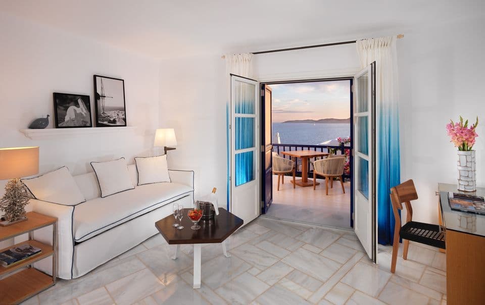 Sea View Suite with separate living room is an oasis of luxurious idleness embodying the island’s stylish taste with cool Dionysos marble floors.