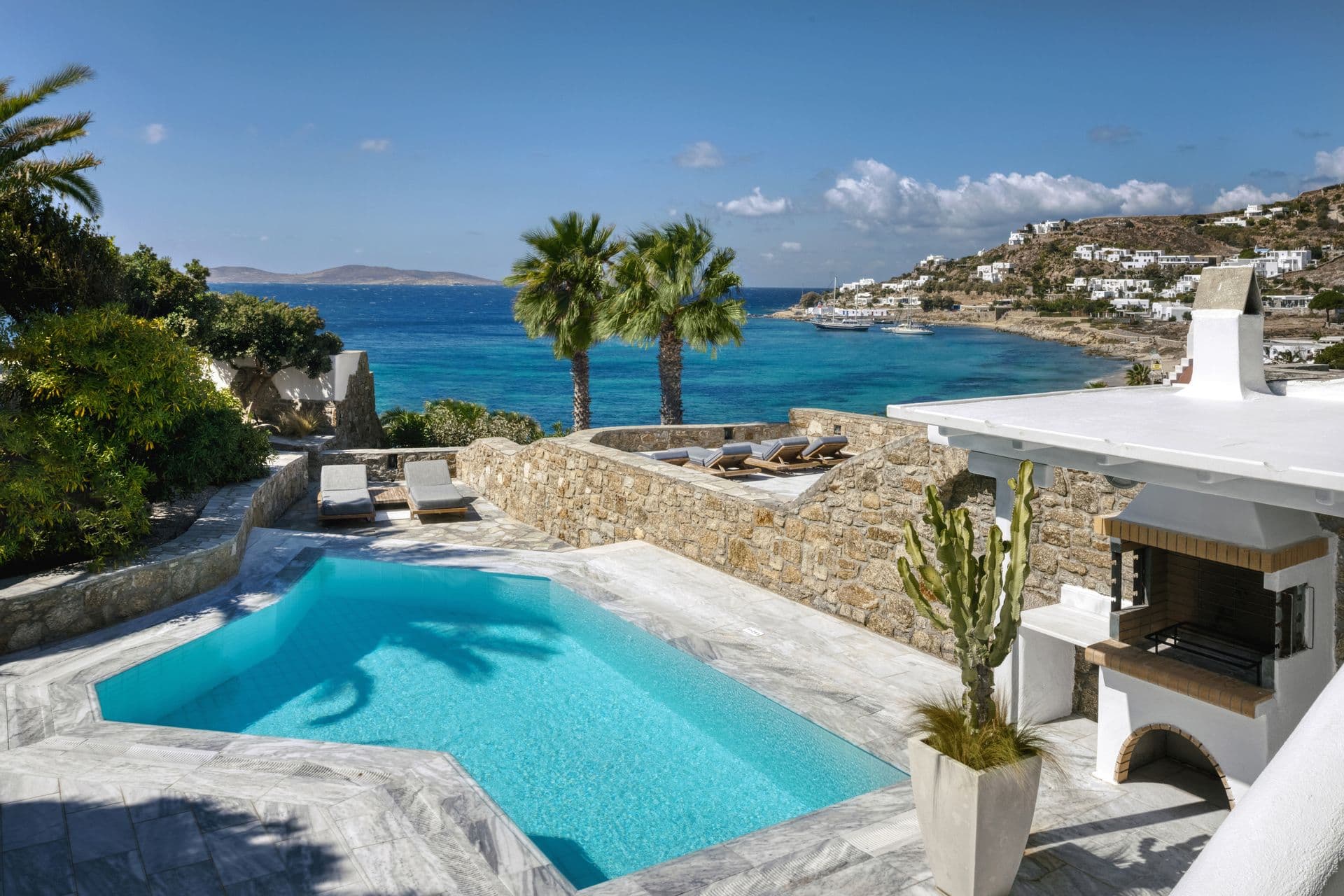 All suites with private pool offer spacious terraces with expansive views to the Aegean and sacred island of Delos