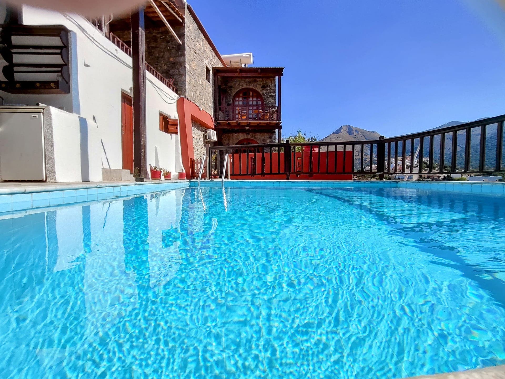 Elounda Swimming Pool Cretan retreat. Authentic stone holiday house Penelope with olive grove views